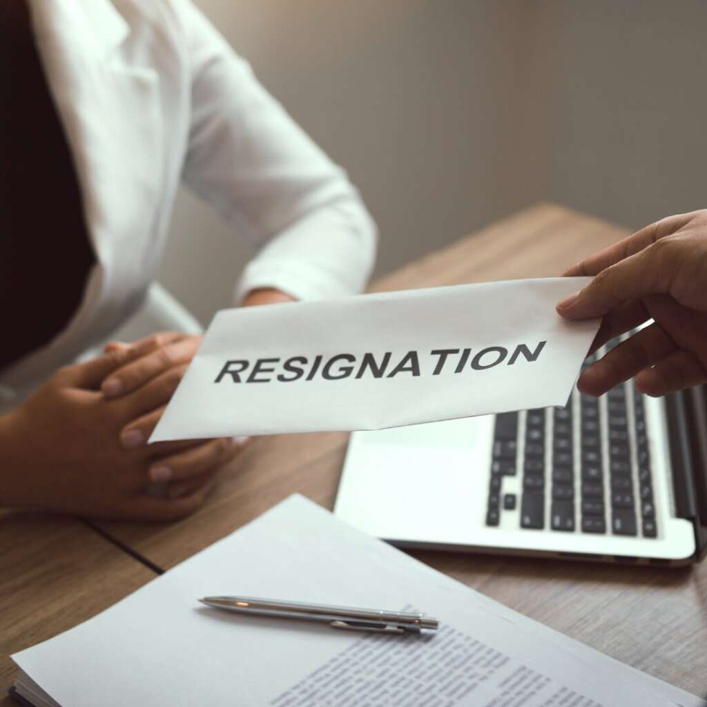 Employee handing a resignation letter over to an employer, trade secret protection 2026.